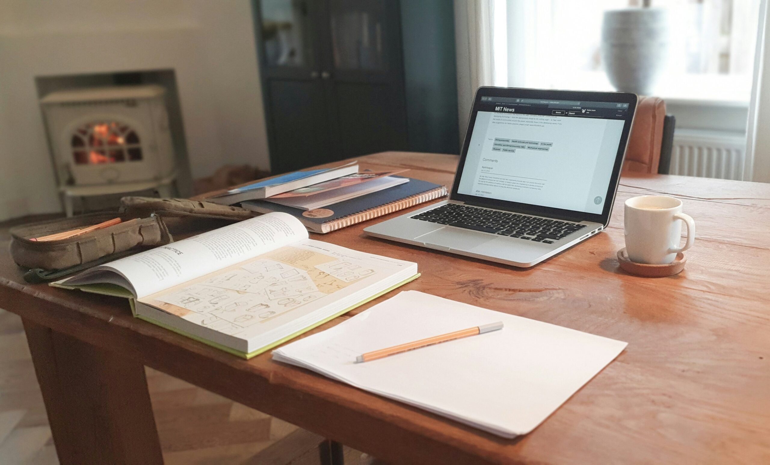 A calm workspace with a laptop open to an email opt-in form, representing a lead magnet that attracts aligned subscribers.